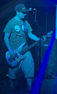 Scott playing bass on stage at the Shred Shed.